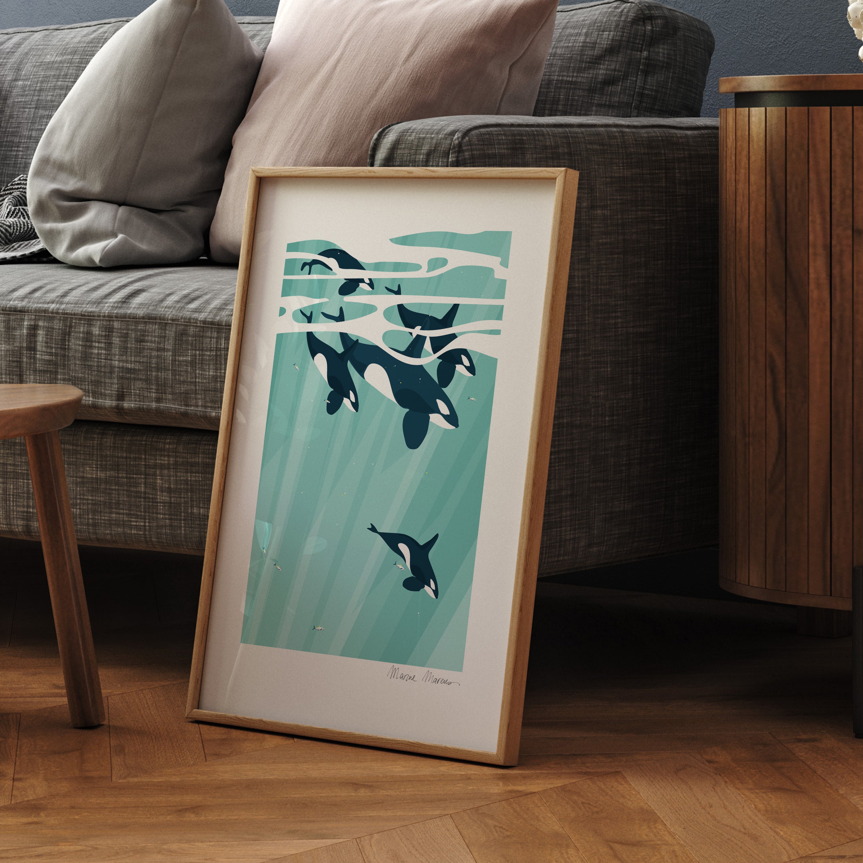 Framed artwork of orcas in a teal ocean.
